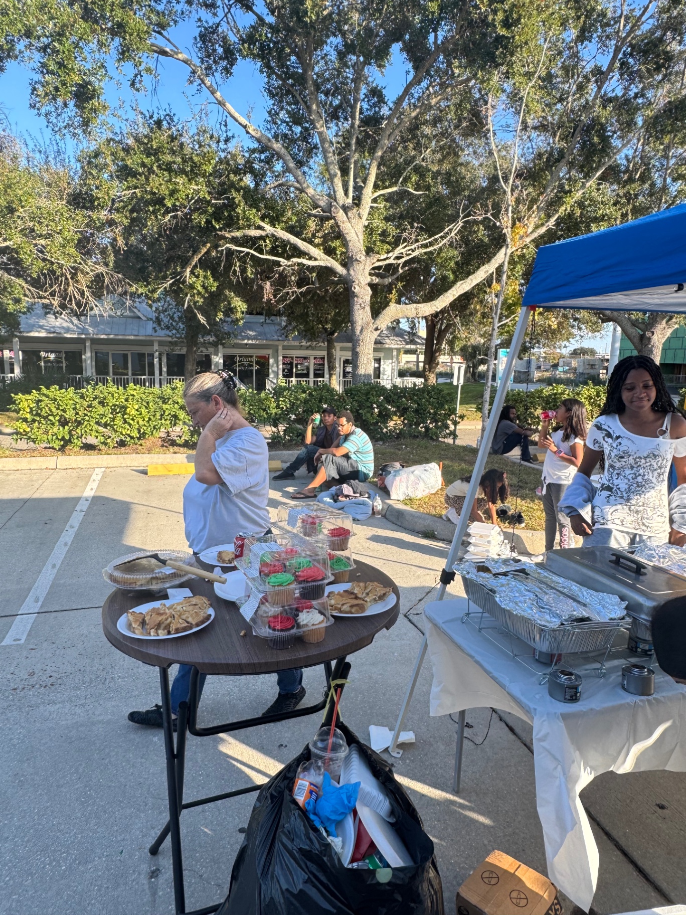 Tables with pies, cupcakes and holiday desserts served at the Christmas 2025 community meal