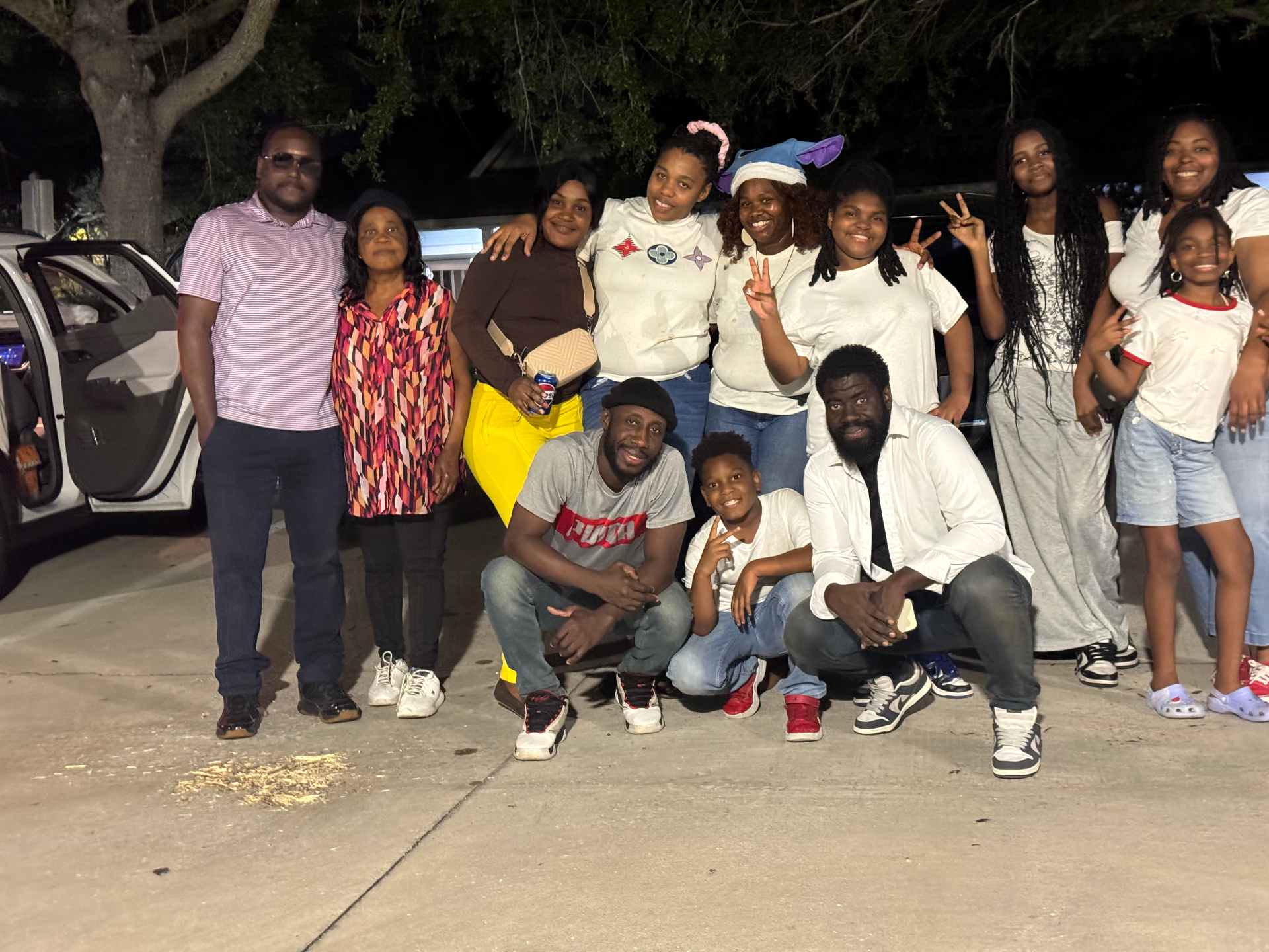 Group photo of volunteers and guests celebrating at the Christmas 2025 community meal