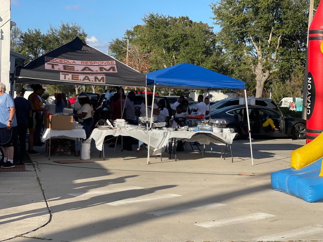 Outdoor meal stations with food prepared for the Christmas 2025 community meal